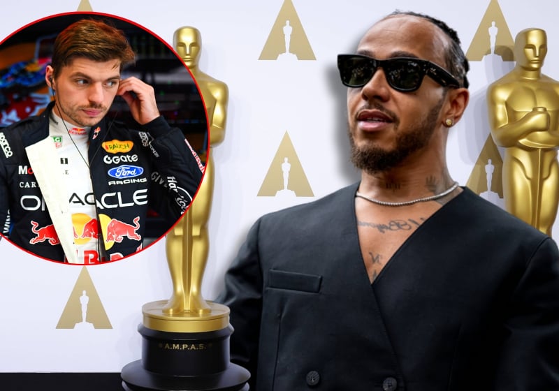 Hamilton in black suit with Oscars-themed awards background featuring circular inset of Verstappen in Red Bull garage in race suit
