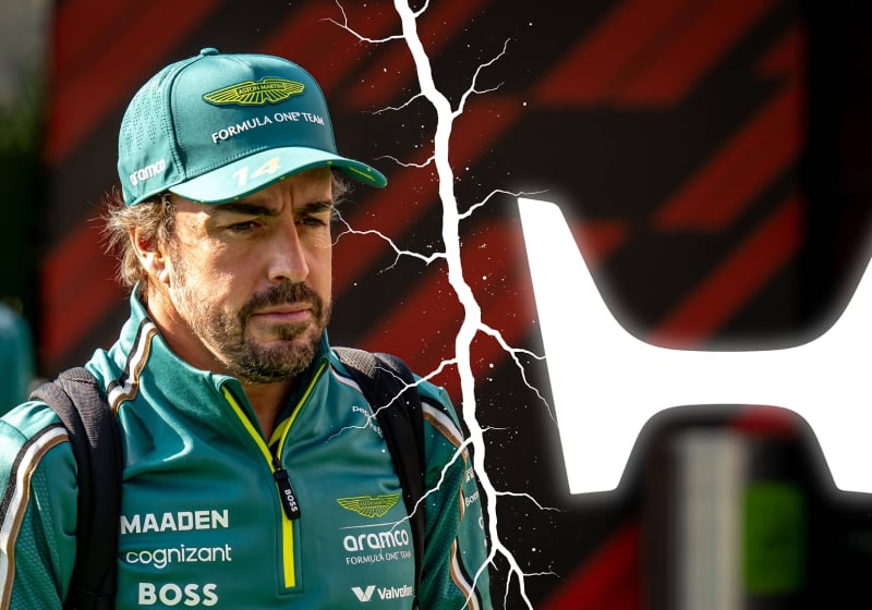 Fernando Alonso and a Honda logo are split by a crack in the picture