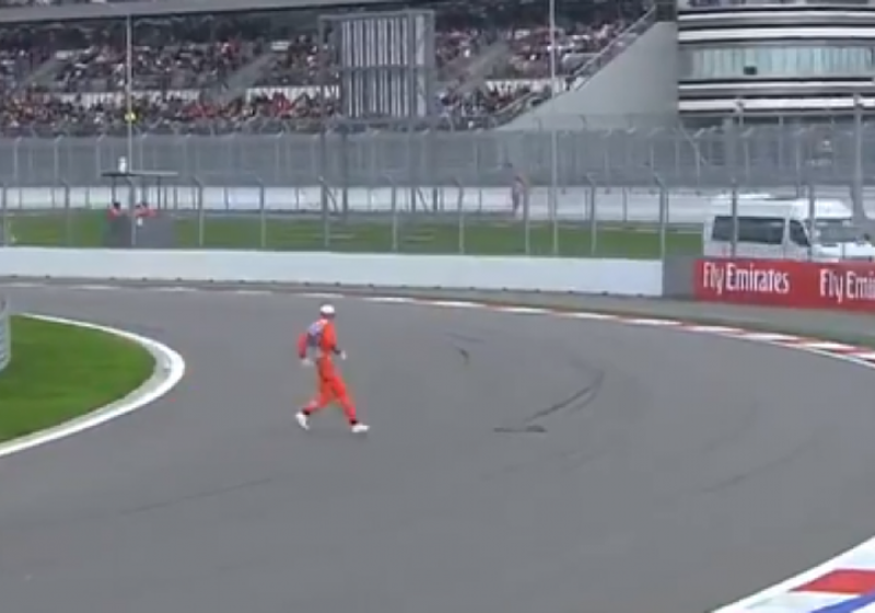 VIDEO: Crazy Russian marshal darts across the track!