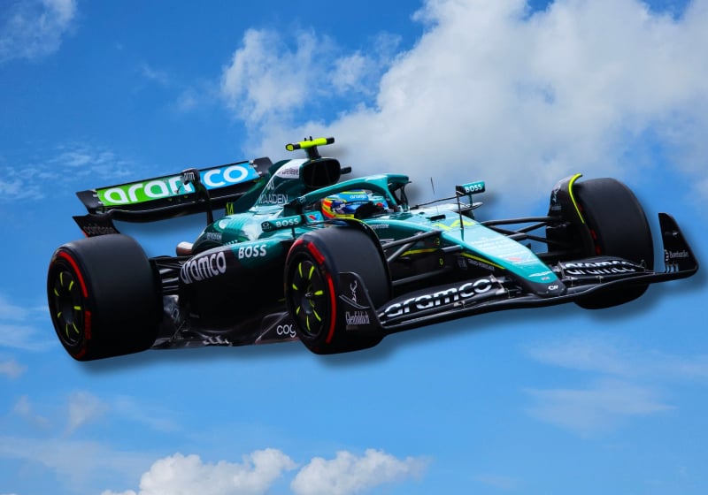 An Aston Martin F1 car is pictured in the sky as if it is flying