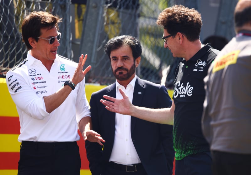 Toto Wolff, Mattia Binott, Mohammed Ben Sulayem in conversation walking down the paddock