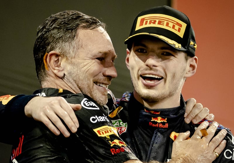 Christian Horner and Max Verstappen hug after winning the 2021 F1 drivers' title