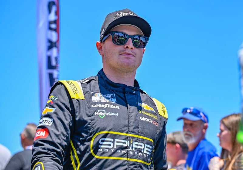 An image of NASCAR driver Justin Haley walking off the track