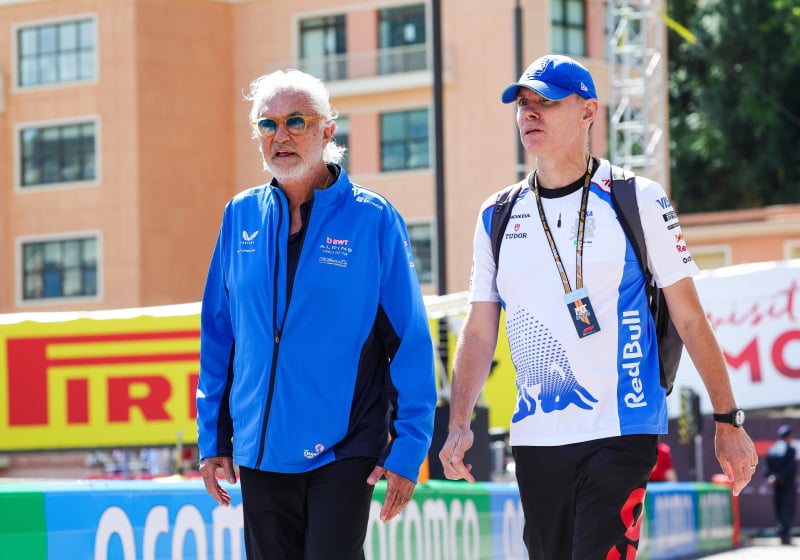 Alan Permane and Flavio Briatore walk through the paddock at the Monaco Grand Prix