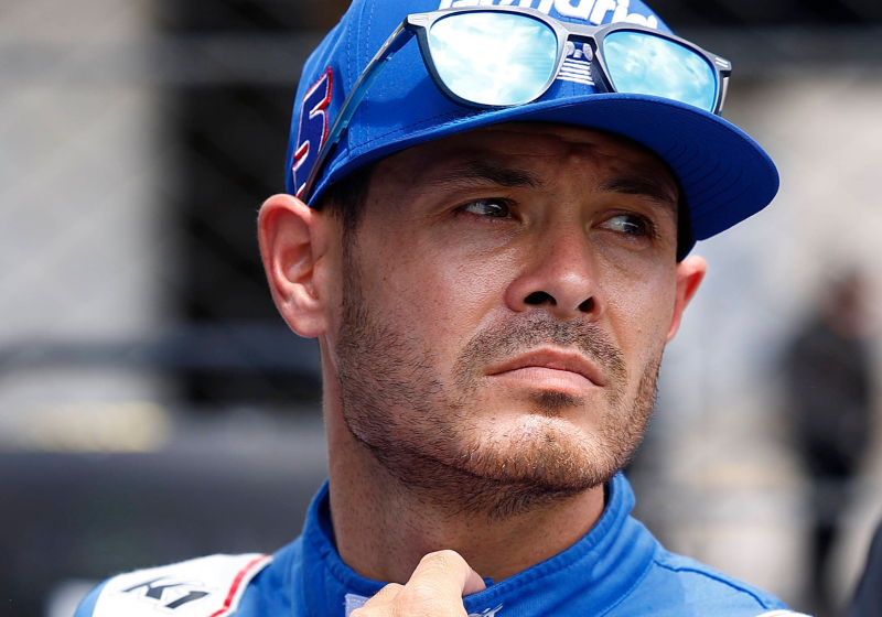NASCAR driver Kyle Larson looking into the distance with a frown