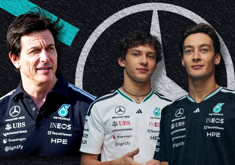 Toto Wolff looks at his drivers George Russell and Kimi Antonelli to a Mercedes logo background