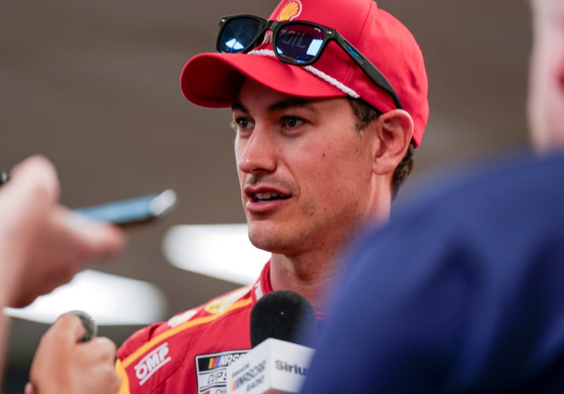 An image of NASCAR driver Joey Logano talking to the media
