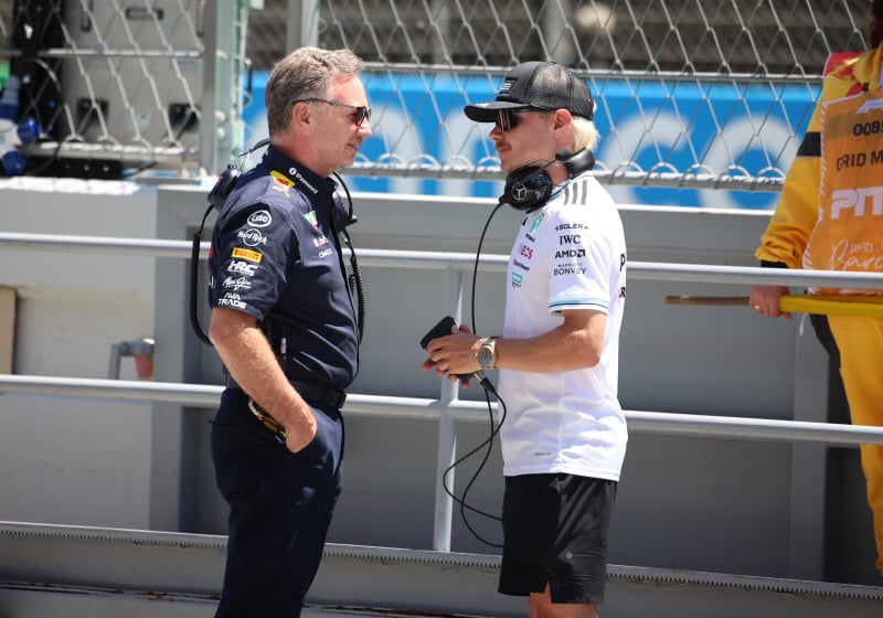 Valtteri Bottas and Christian Horner talk to one another