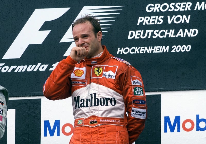 A tearful looking Rubens Barrichello celebrates winning the 2000 German Grand Prix on the podium