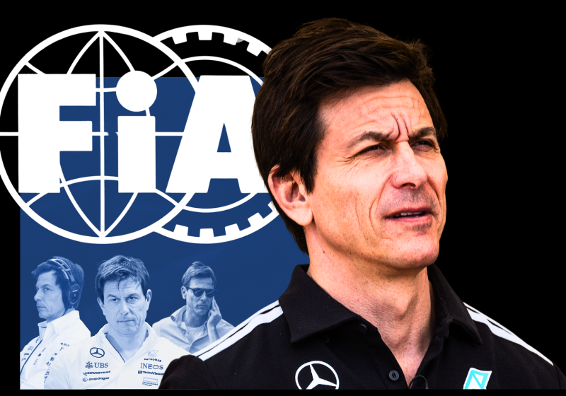 Blue and white FIA logo on top of black background with concerned Toto Wolff in foreground